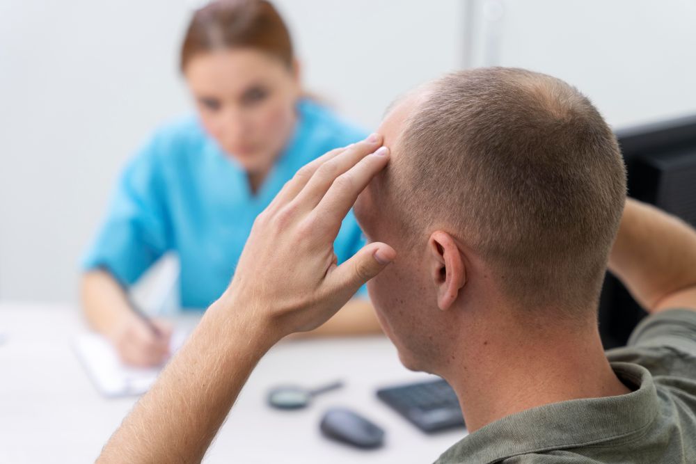 Patient in emotional distress talking with nurse